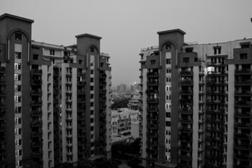grayscale photo of high rise buildings
