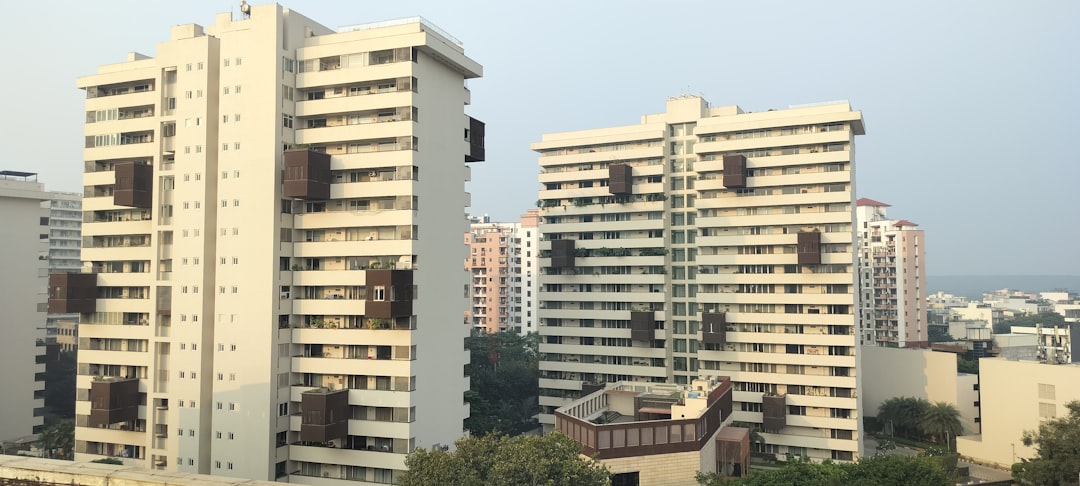 a couple of tall buildings sitting next to each other