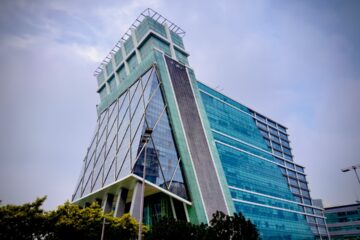 a very tall building with a sky background
